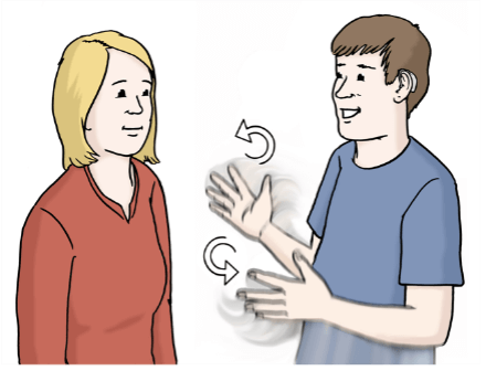 Ein Mann und eine Frau stehen sich gegenüber. Beide sind jung. Sie lachen. Der Mann macht Hand-Zeichen. Die Frau sieht zu. Der Mann erzählt der Frau etwas. Er erzählt mit Hand-Zeichen. Das nennt man: Gebärden-Sprache.